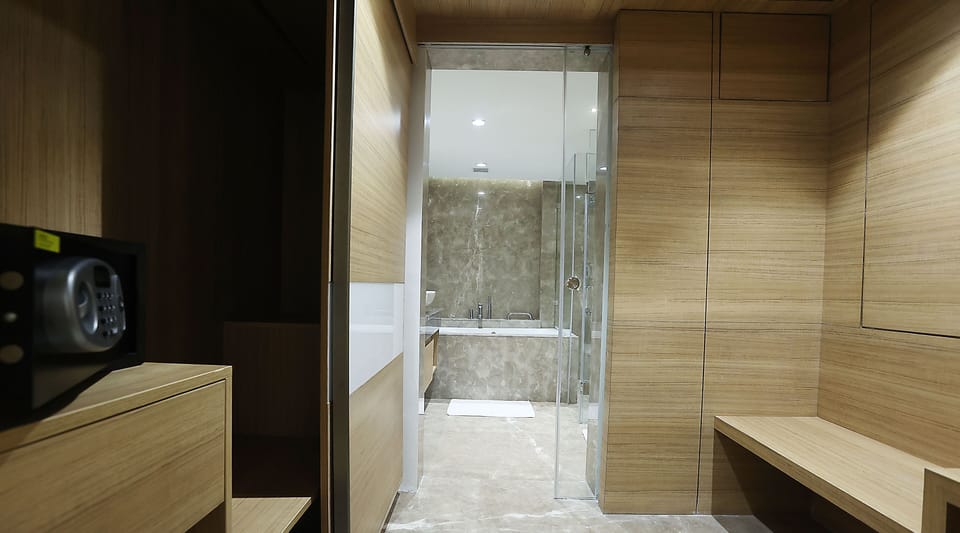 Executive Suite, 1 Double Bed | Bathroom | Shower, hair dryer, slippers, towels