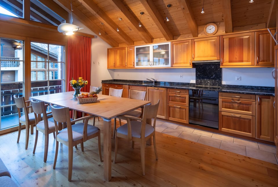 Three-Bedroom Attic Apartment | Living area | 101-cm flat-screen TV with cable channels, TV, DVD player