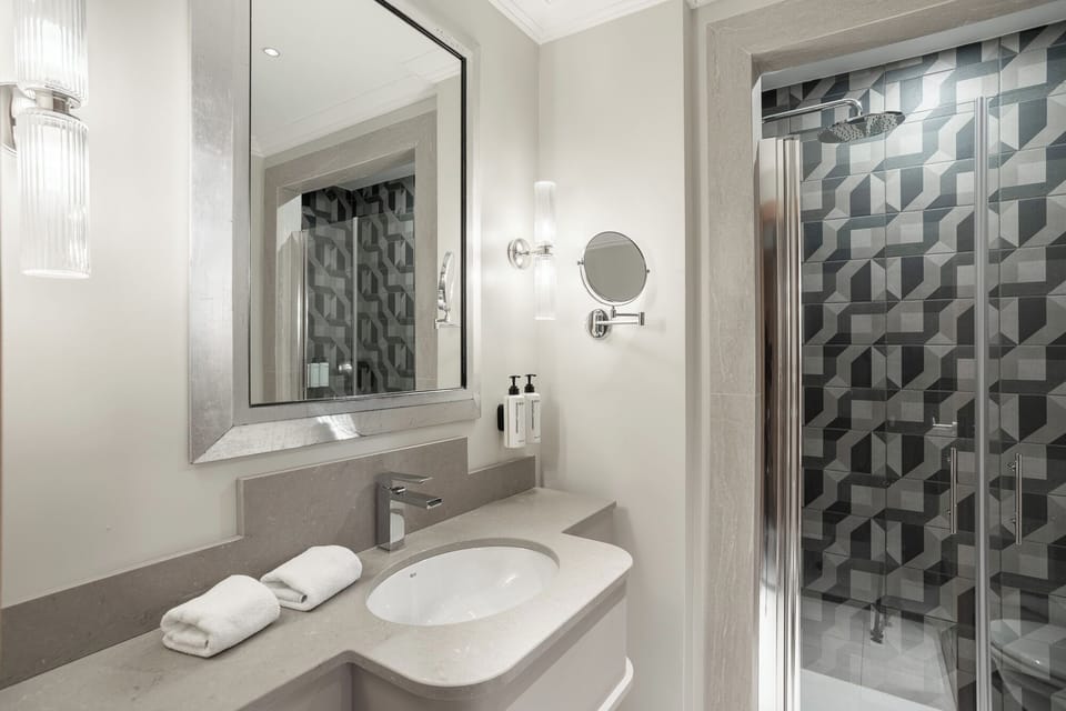 Executive Room | Bathroom | Designer toiletries, hair dryer, bathrobes, slippers
