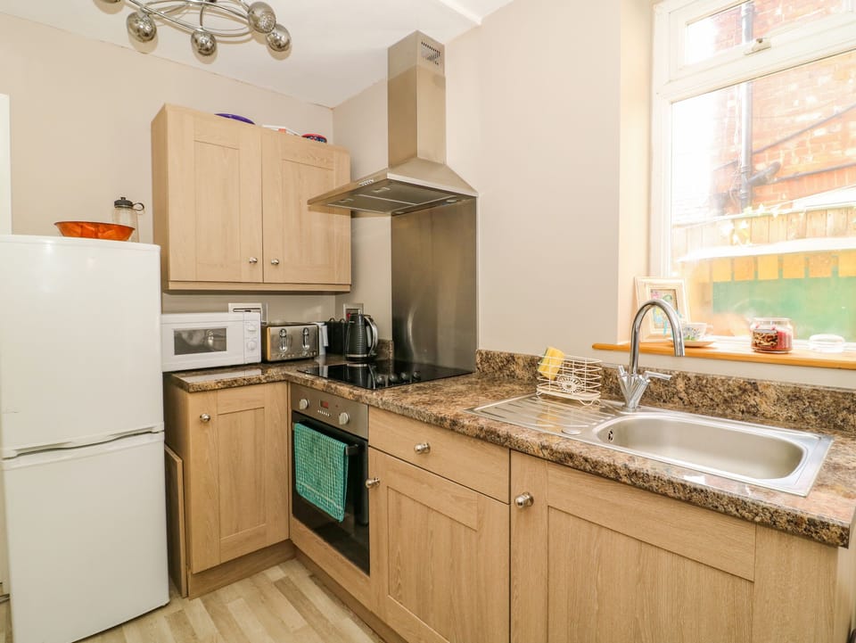 Fridge, electric kettle, toaster, cookware/dishes/utensils