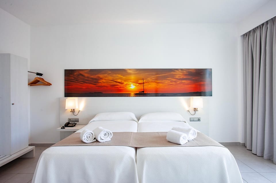 Quadruple Room, Balcony | Minibar, in-room safe, desk, laptop workspace