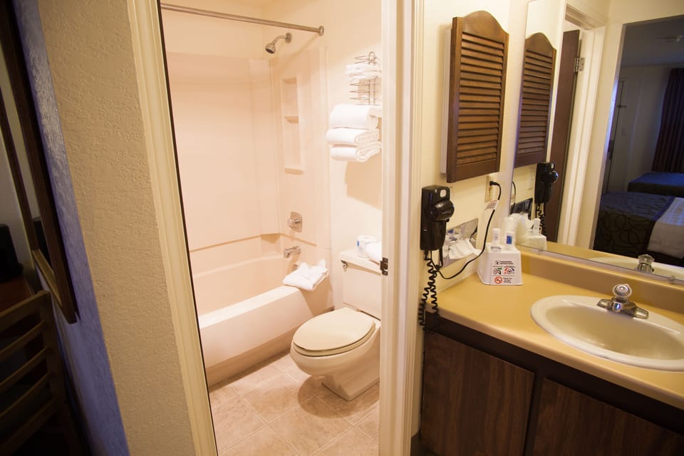 Standard Room, 2 Queen Beds | Bathroom | Combined shower/tub, hair dryer, towels