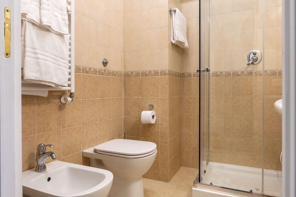 Deluxe Triple Room, Balcony | Bathroom | Shower, rainfall showerhead, free toiletries, hair dryer