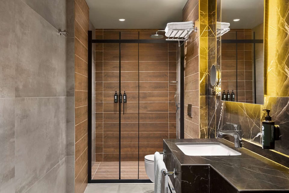 Shower, rainfall showerhead, eco-friendly toiletries, hair dryer