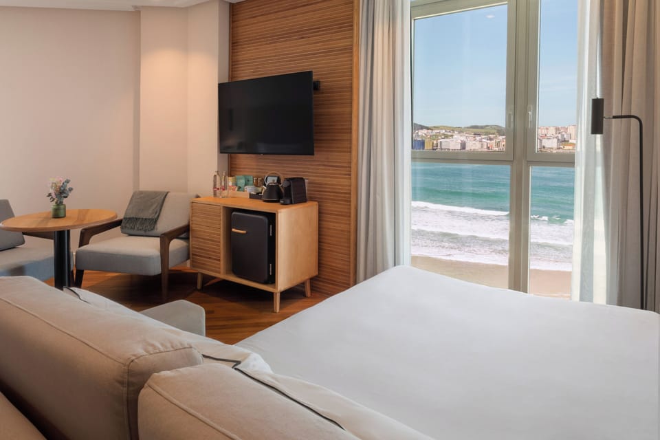 Junior Suite, Sea View | In-room safe, desk, blackout drapes, iron/ironing board