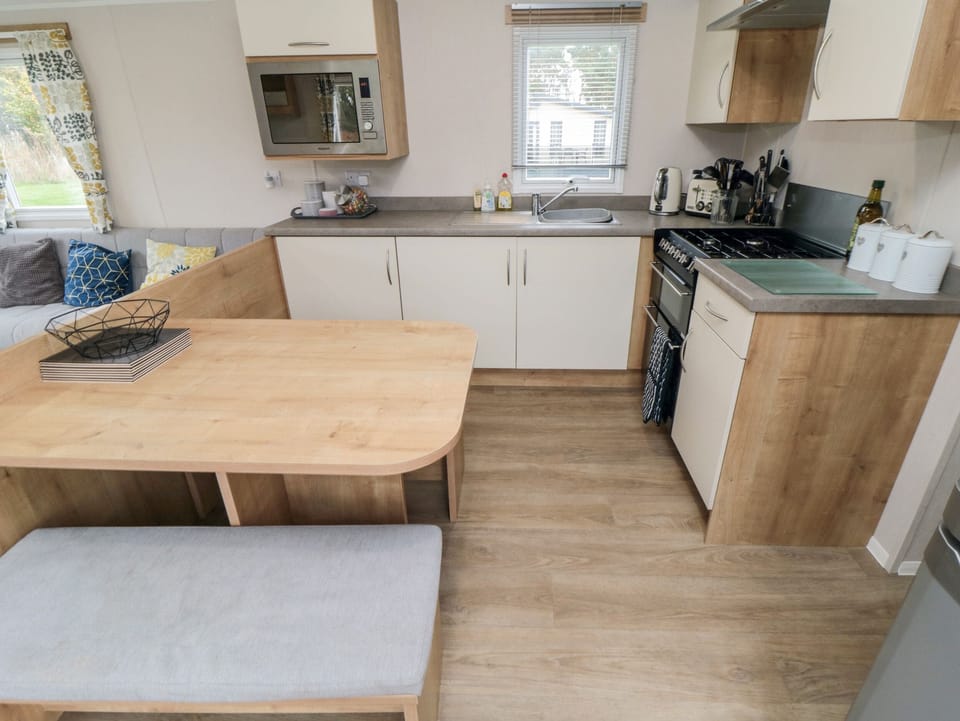 Fridge, electric kettle, toaster, cookware/dishes/utensils