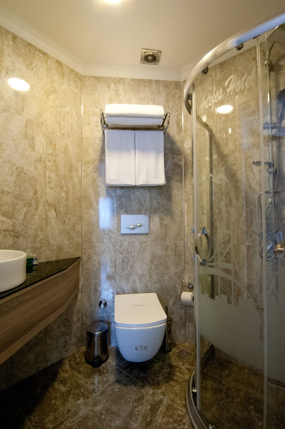 Shower, designer toiletries, hair dryer, slippers