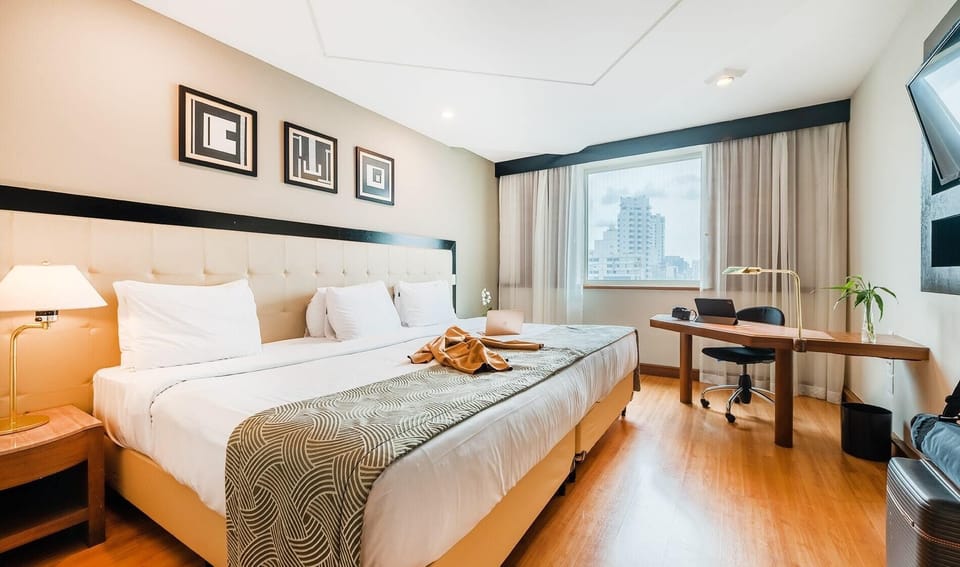 Family Room | Minibar, in-room safe, desk, blackout drapes