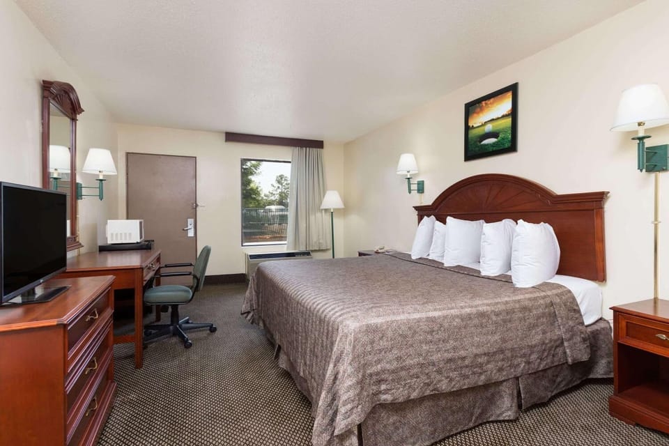 Desk, blackout drapes, iron/ironing board, rollaway beds