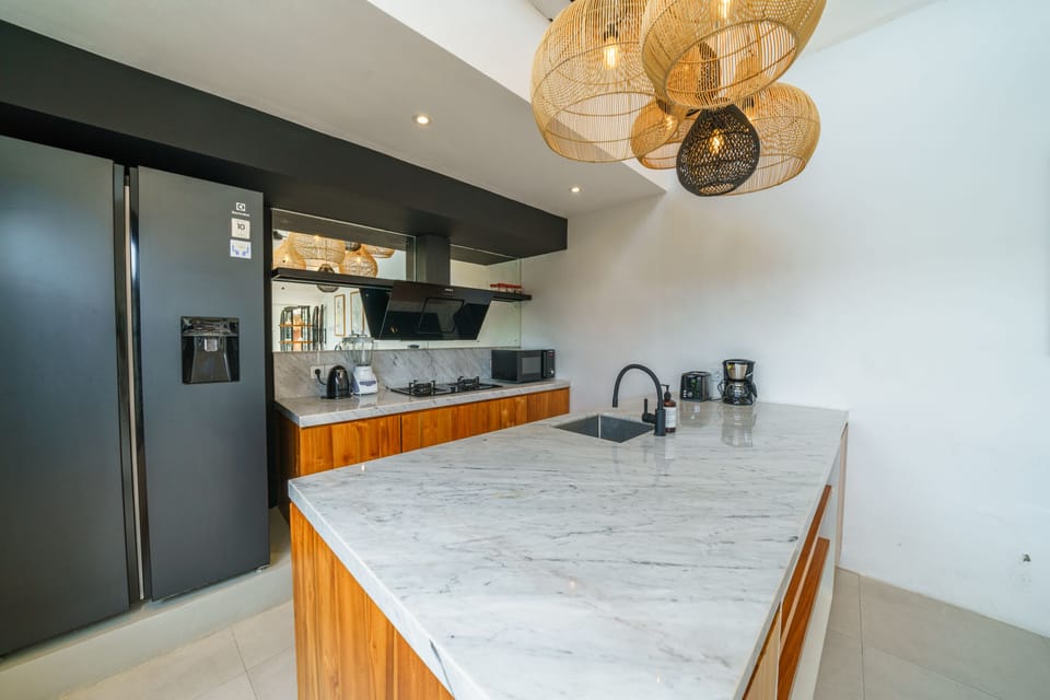 Deluxe Villa | Private kitchen | Full-size fridge, microwave, stovetop, coffee/tea maker
