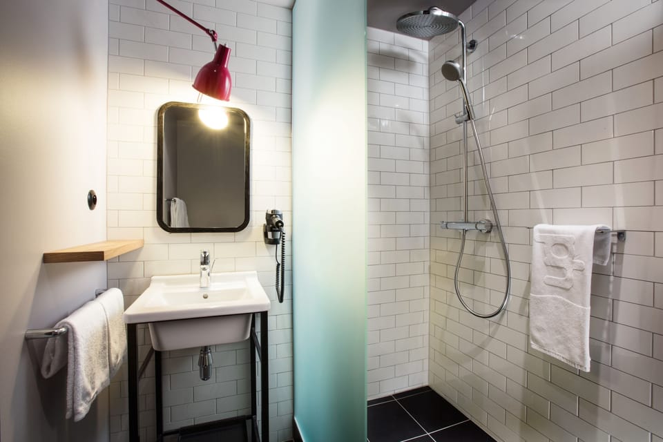 Rainfall showerhead, eco-friendly toiletries, hair dryer, towels