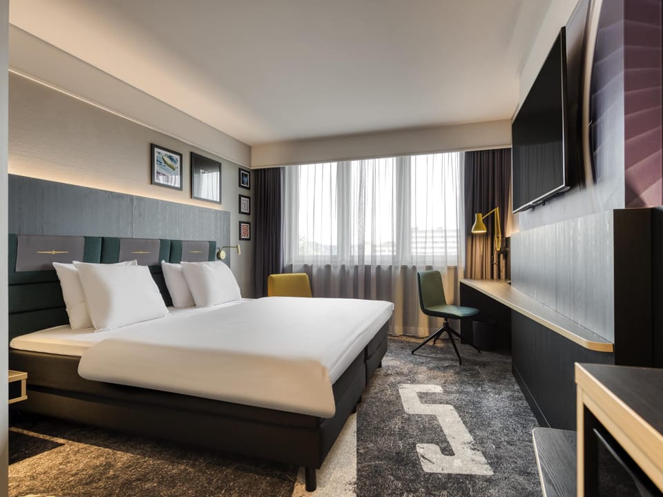 Premium bedding, down comforters, in-room safe, desk