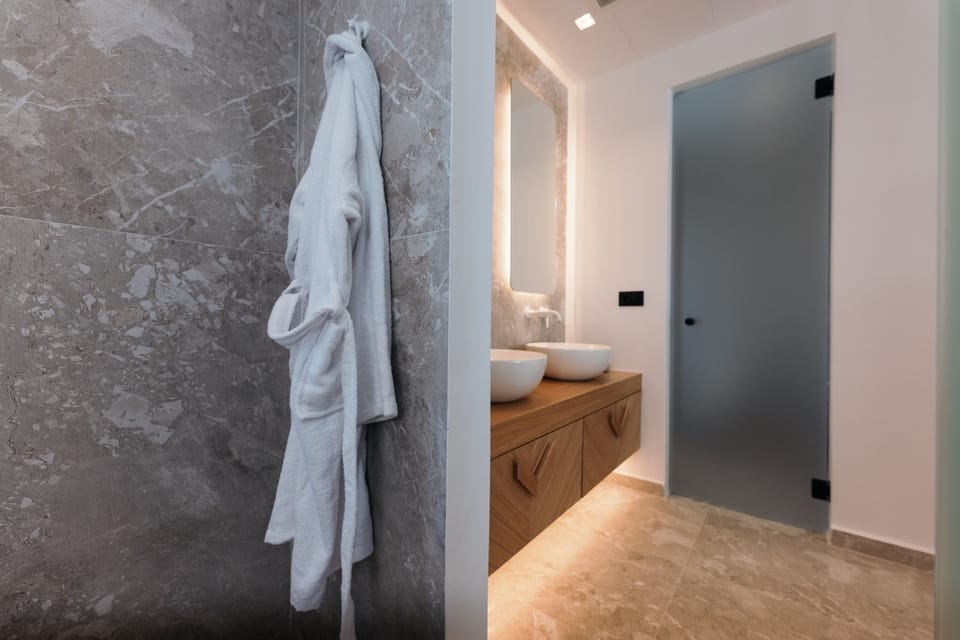 Separate tub and shower, hair dryer, bathrobes, towels
