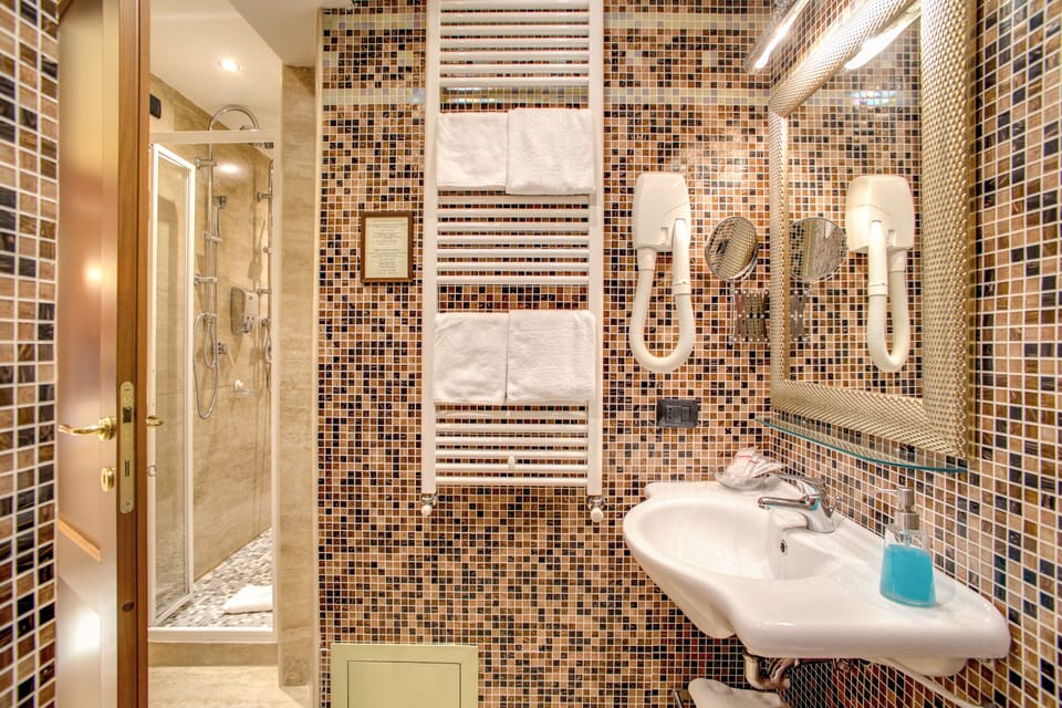 Shower, free toiletries, hair dryer, slippers