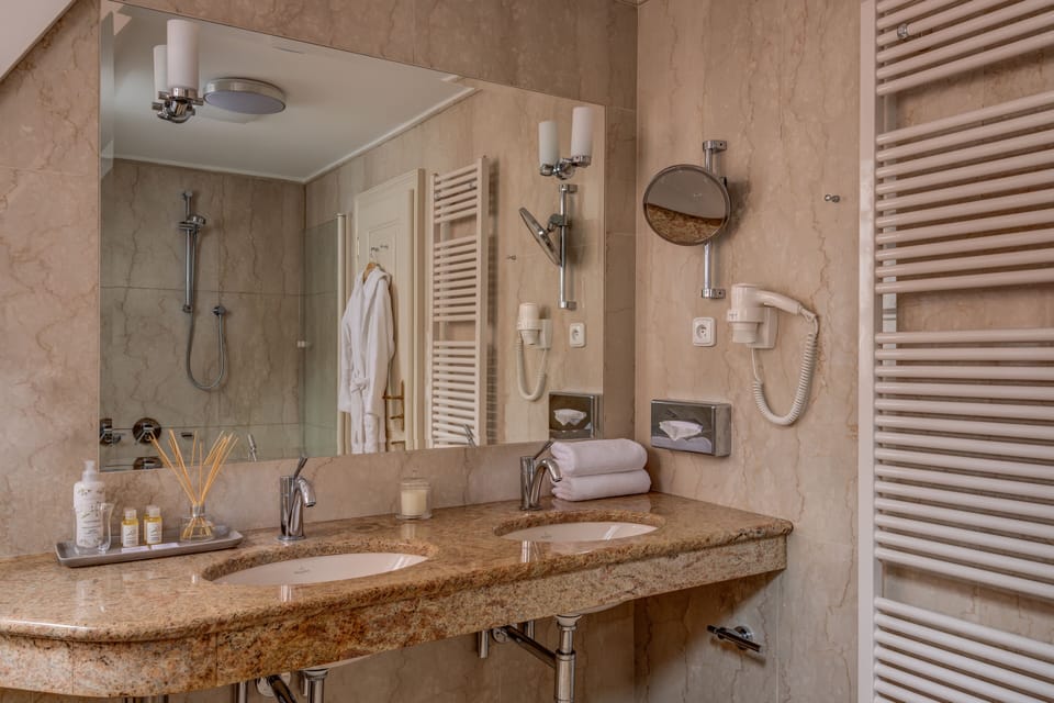 Presidential Suite | Bathroom | Designer toiletries, hair dryer, bathrobes, slippers