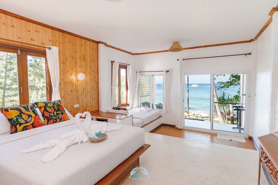 Beachfront Triple Room | Blackout drapes, soundproofing, free WiFi