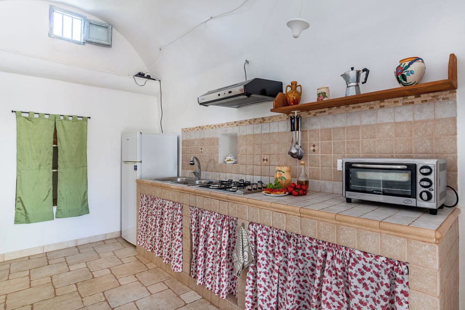 Family Villa, Multiple Bedrooms (Trullo Di Nonna Cecca) | Private kitchen | Fridge, microwave, stovetop, coffee/tea maker