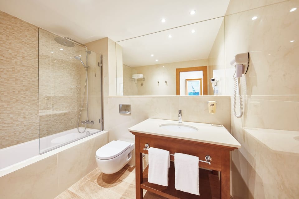 Eco-friendly toiletries, hair dryer, towels