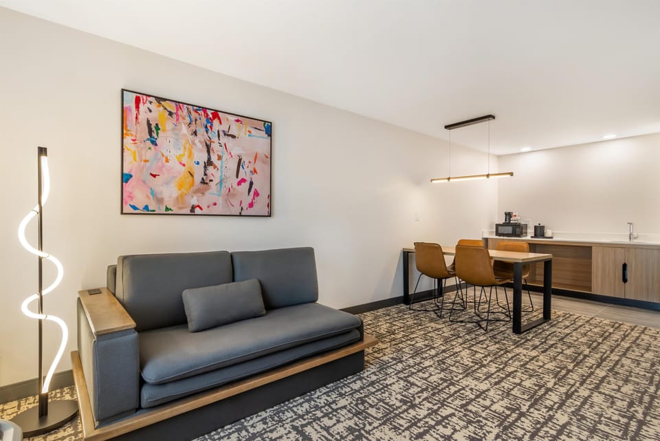 Suite, 1 King Bed with Sofa Bed, Non Smoking | Living area | 50-inch LCD TV with cable channels, TV