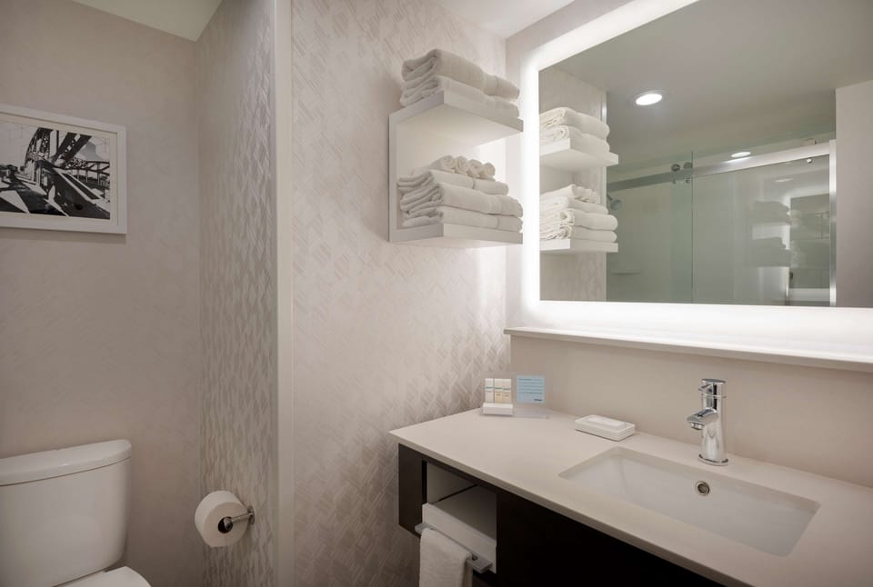 Designer toiletries, hair dryer, towels, soap