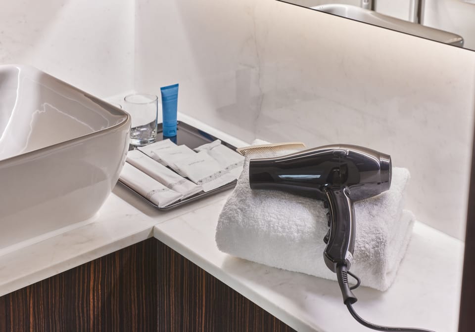 Eco-friendly toiletries, hair dryer, towels, soap