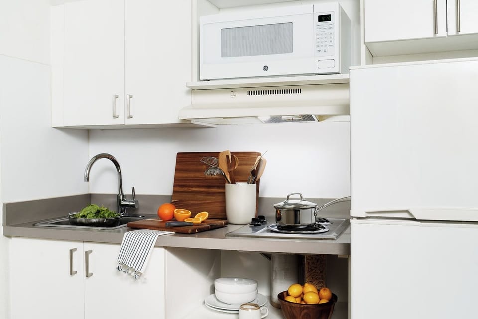 Fridge, microwave, stovetop, dining tables