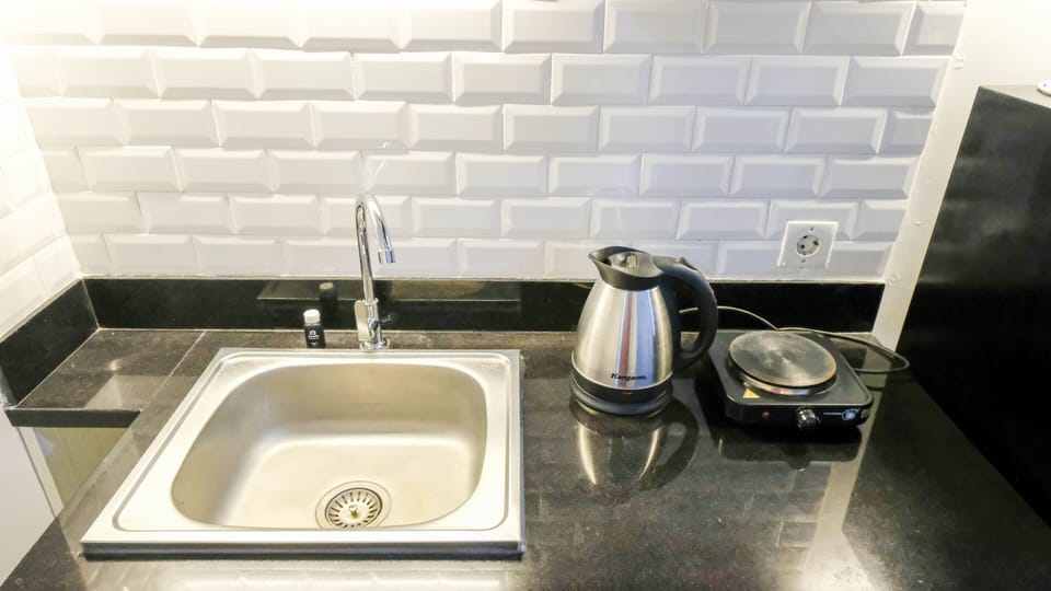 Studio | Private kitchen | Fridge, stovetop, cookware/dishes/utensils, dining tables