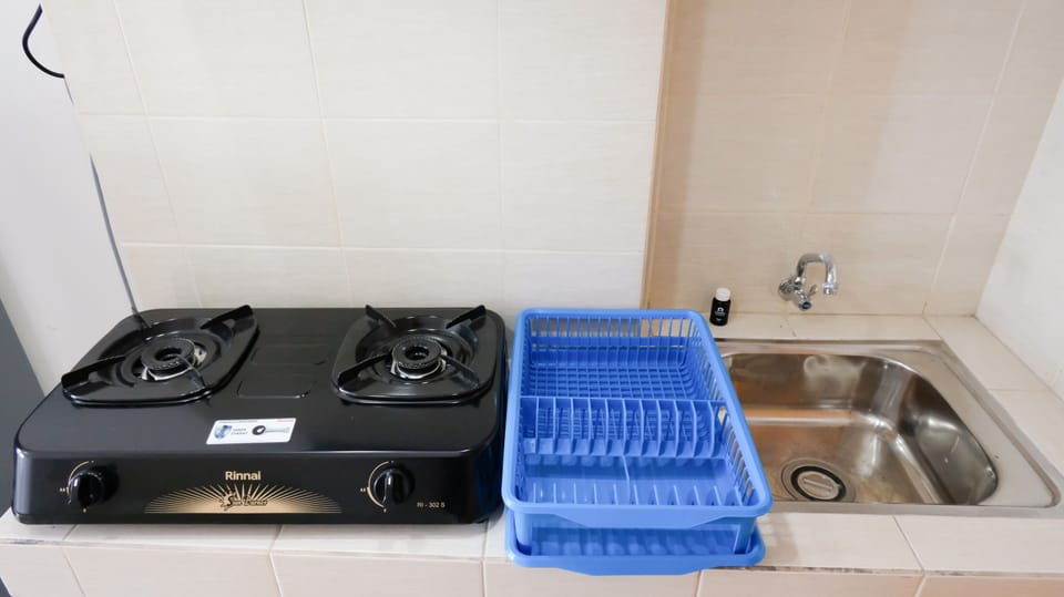 Studio | Private kitchen | Fridge, stovetop, cookware/dishes/utensils, dining tables
