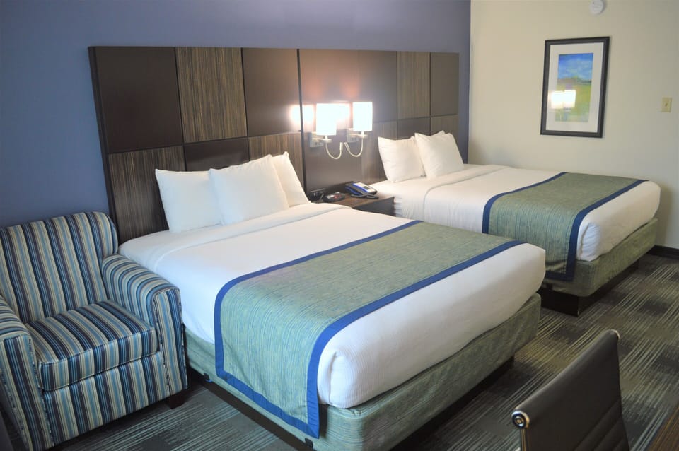 Standard Room, 2 Queen Beds | 1 bedroom, down comforters, individually decorated