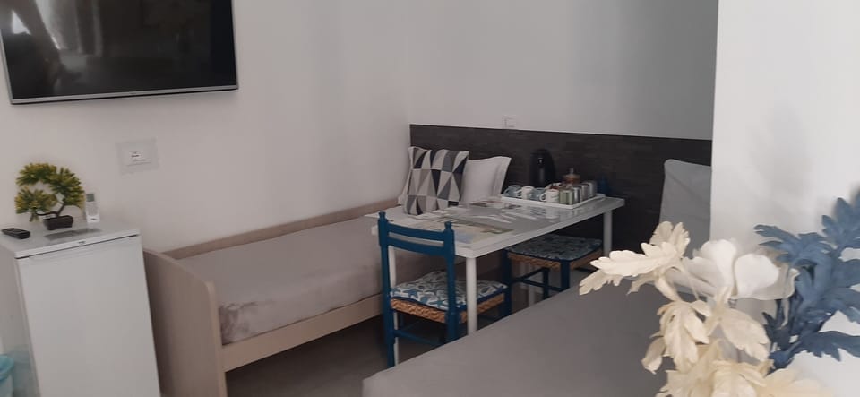 Family Quadruple Room, Non Smoking | Down comforters, in-room safe, desk, laptop workspace