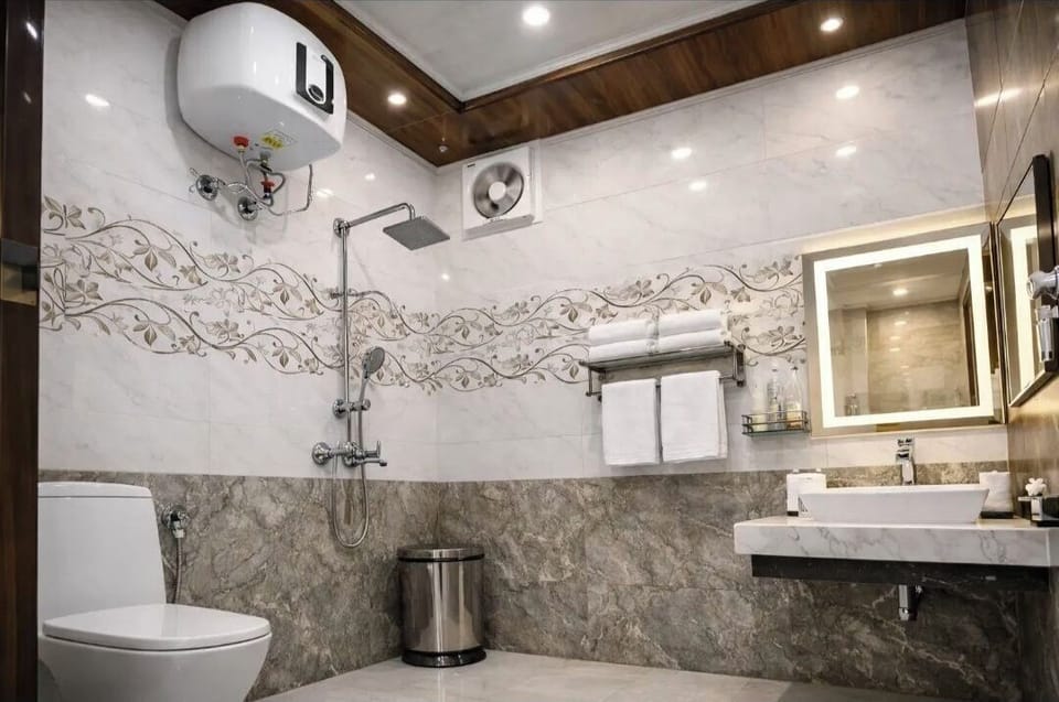Shower, rainfall showerhead, towels, soap