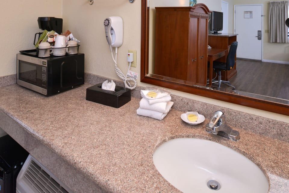 Two Queens ground floor across from pool | Bathroom | Free toiletries, hair dryer, towels, soap