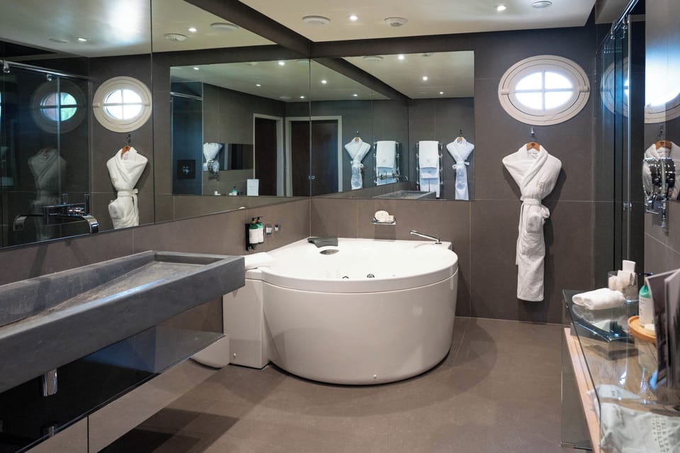 Suite Exception | Bathroom | Separate tub and shower, free toiletries, hair dryer, bathrobes