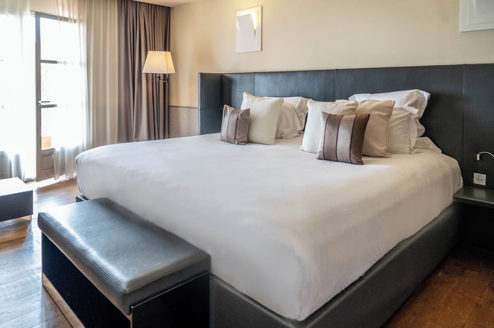 Suite Exception | Premium bedding, pillowtop beds, minibar, in-room safe