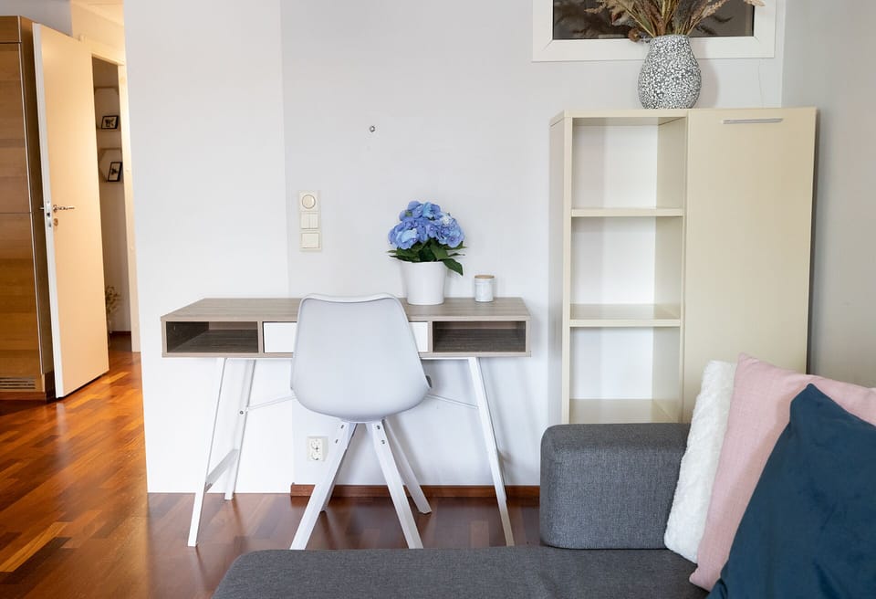 Deluxe Apartment | Living area | 36-inch TV with cable channels