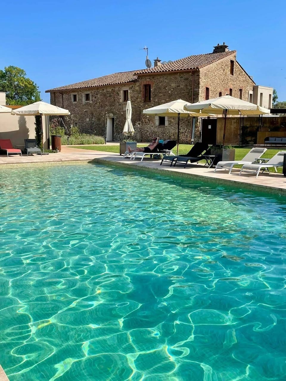 Seasonal outdoor pool, open 10:00 AM to 8:00 PM, pool umbrellas