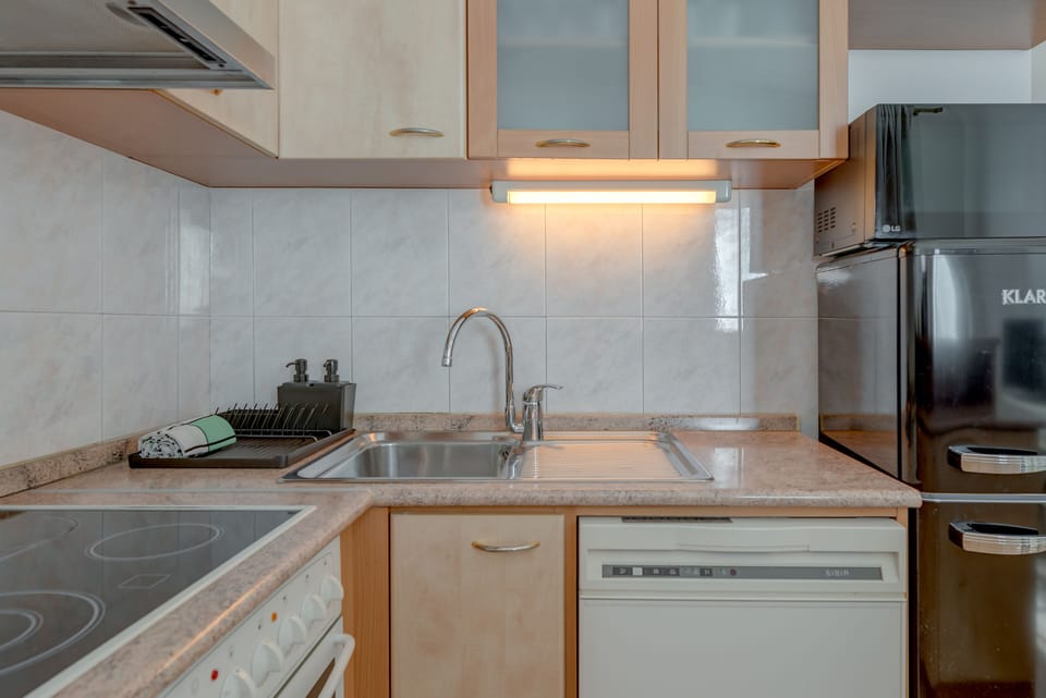 Apartment | Private kitchen | Full-size fridge, microwave, oven, stovetop