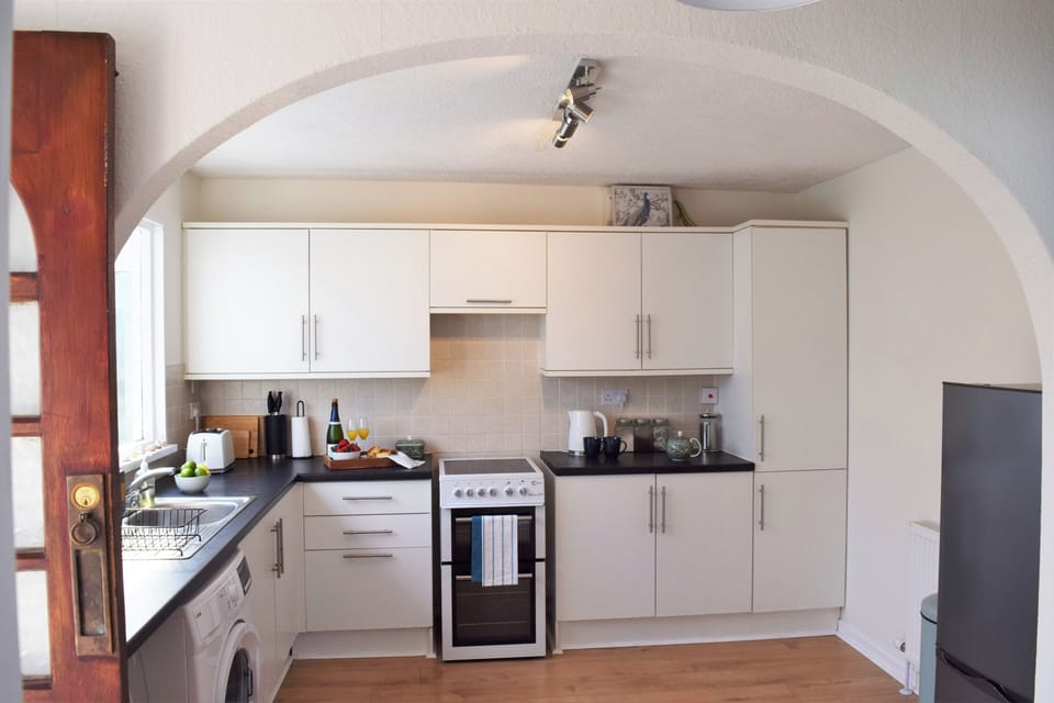 Fridge, electric kettle, toaster, cookware/dishes/utensils