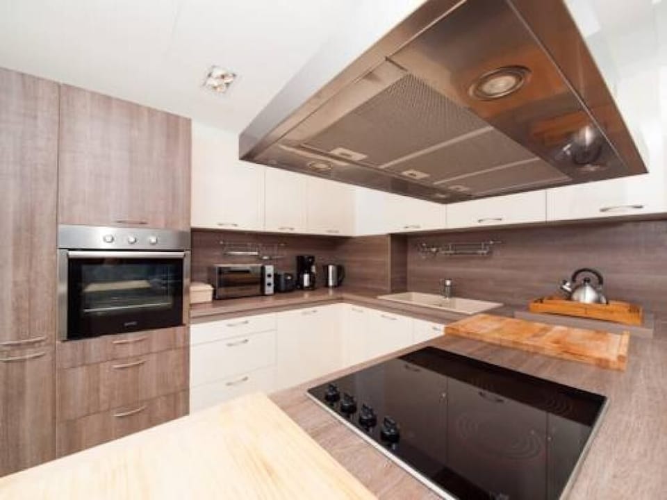 Apartment (Superior Three Bedroom Apartment with) | Private kitchen | Fridge