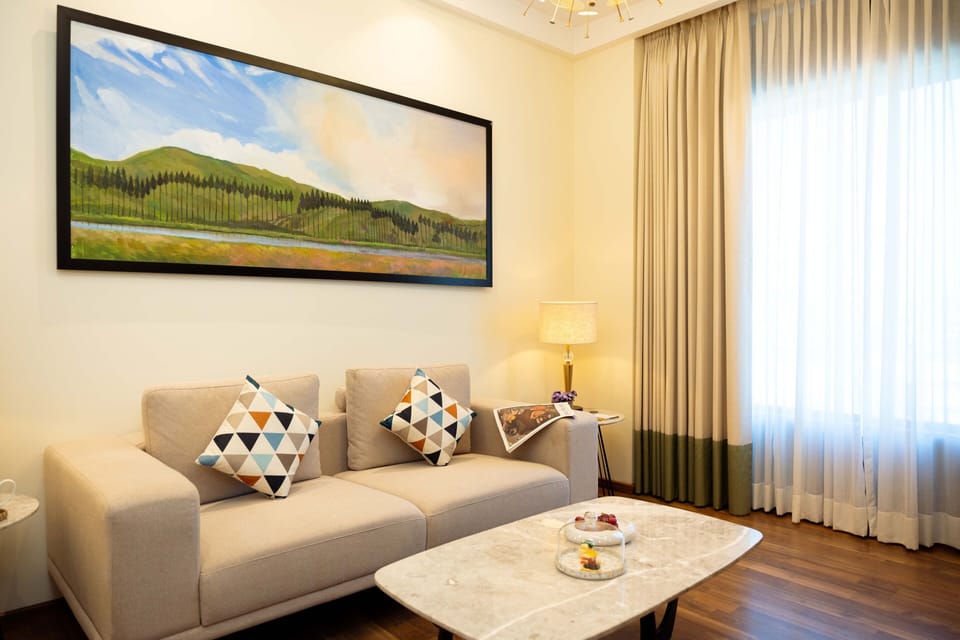 Luxury Studio Suite | Living area | 32-inch flat-screen TV with satellite channels, TV