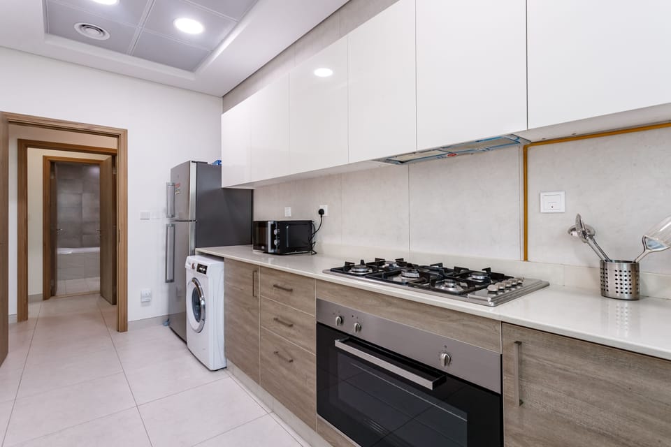 Premium Apartment, 2 Bedrooms, Balcony | Private kitchen | Full-size fridge, microwave, oven, stovetop