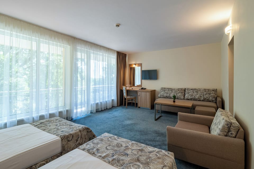 Family Double Room | Minibar, desk, laptop workspace, blackout drapes