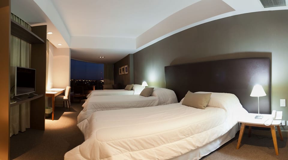 Down comforters, pillowtop beds, in-room safe, desk