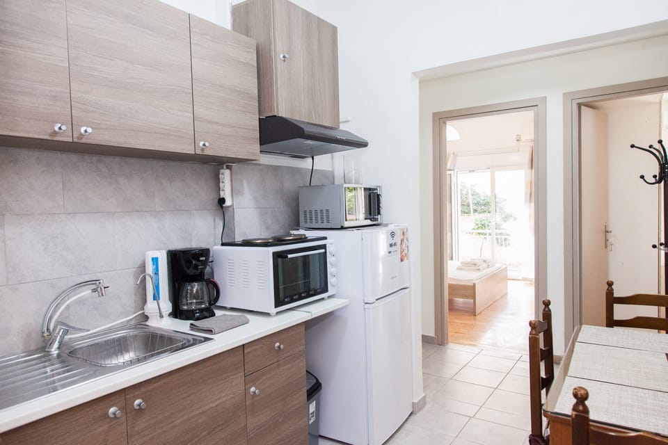 Apartment | Private kitchen | Full-size fridge, microwave, oven, stovetop
