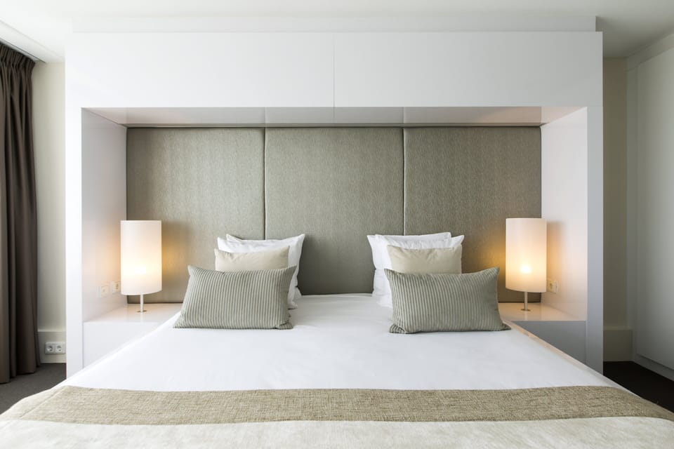 Suite, 1 King Bed, City View | Minibar, in-room safe, desk, blackout drapes