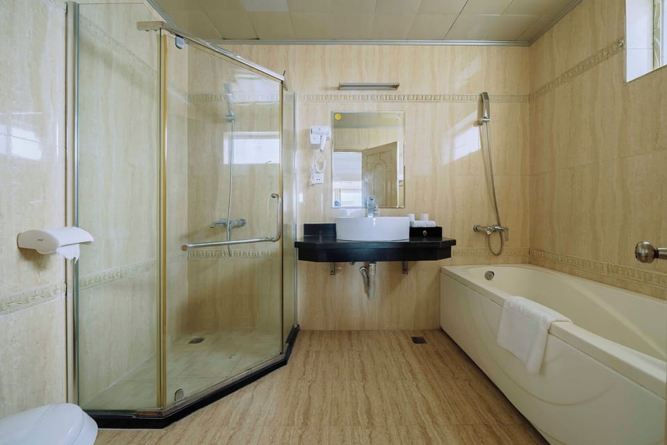 Exclusive Room (Deluxe ) | Bathroom | Shower, free toiletries, hair dryer, slippers