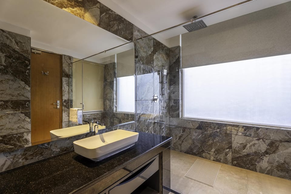 Combined shower/tub, free toiletries, hair dryer, slippers