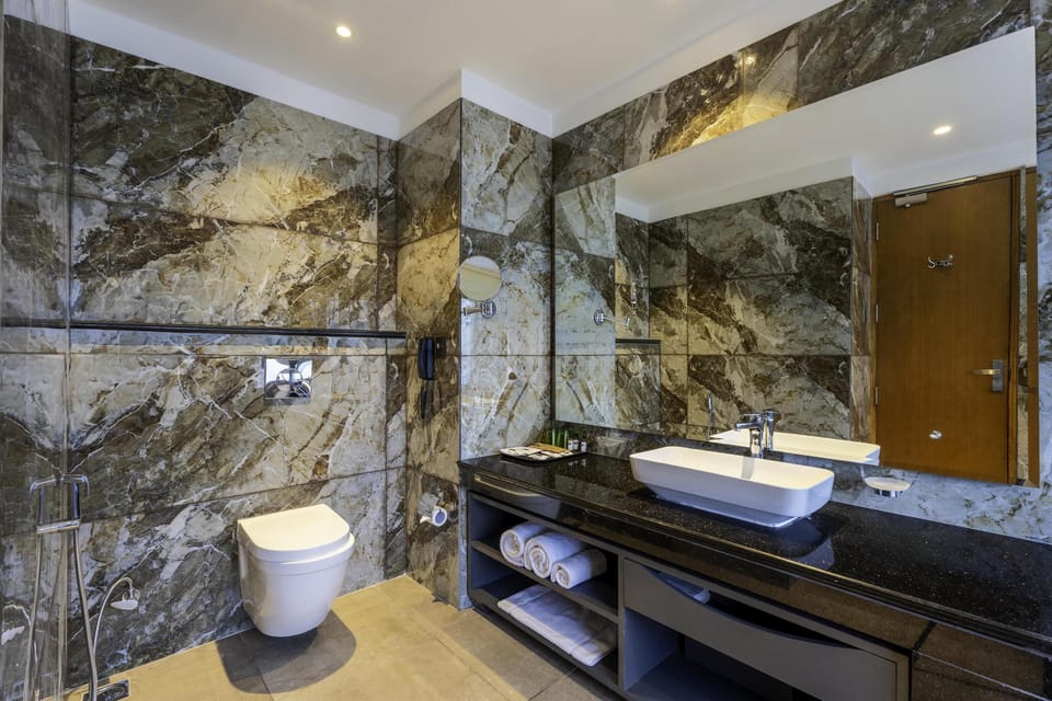 Combined shower/tub, free toiletries, hair dryer, slippers