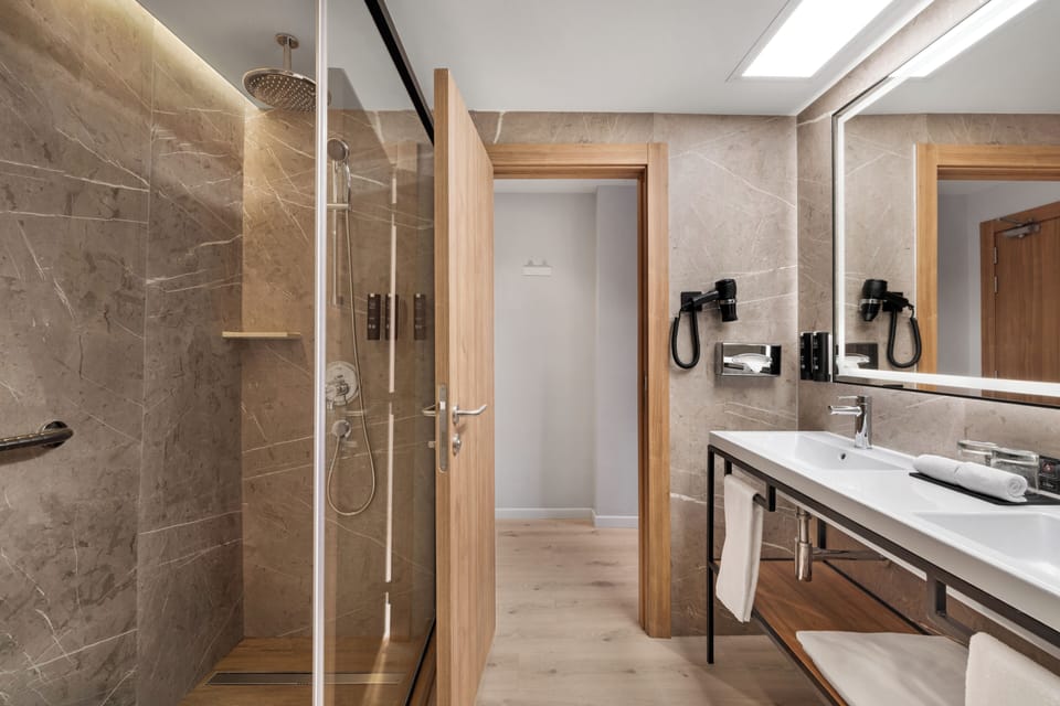 Shower, eco-friendly toiletries, hair dryer, bathrobes