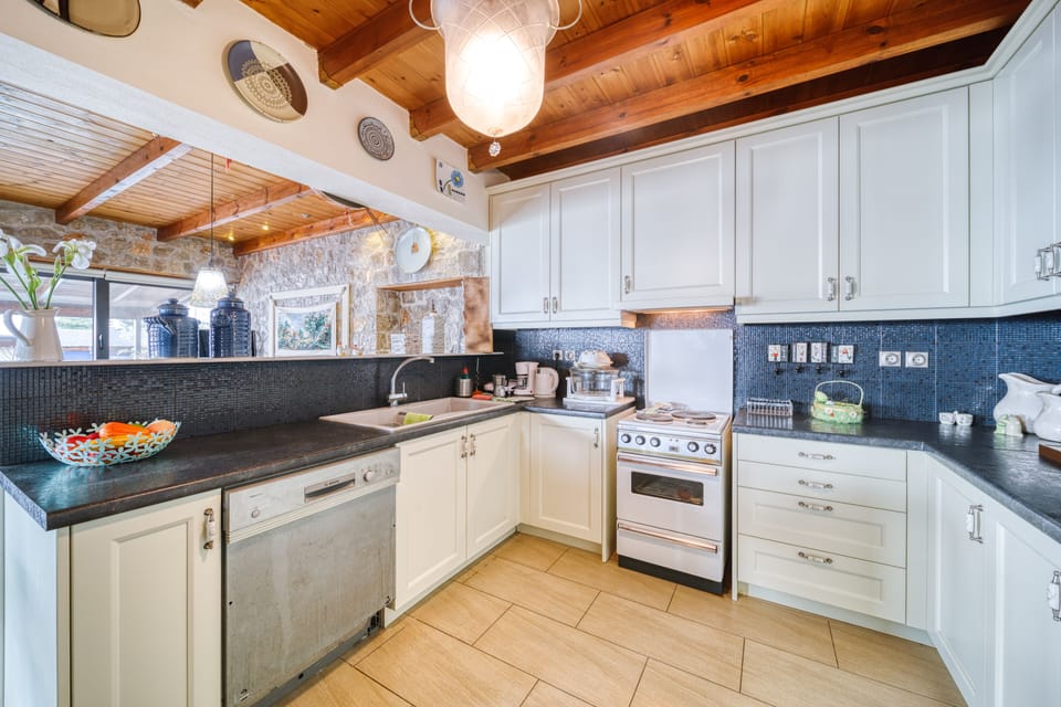 Villa | Private kitchen | Fridge, microwave, oven, stovetop